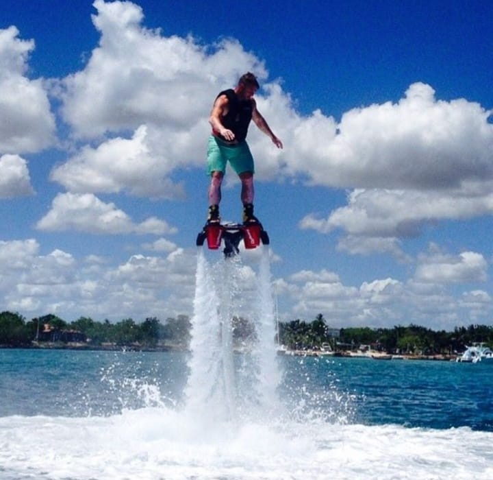 Flyboarder airborne over open water in Goa