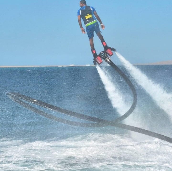 Flyboarder carving a turn mid-air in Goa