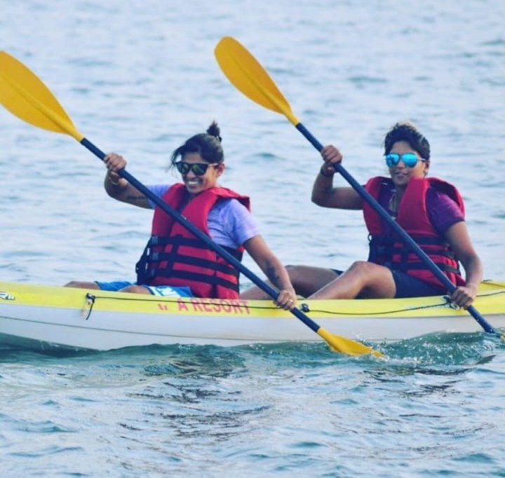 Kayaking on calm water as part of the Goa watersports combo